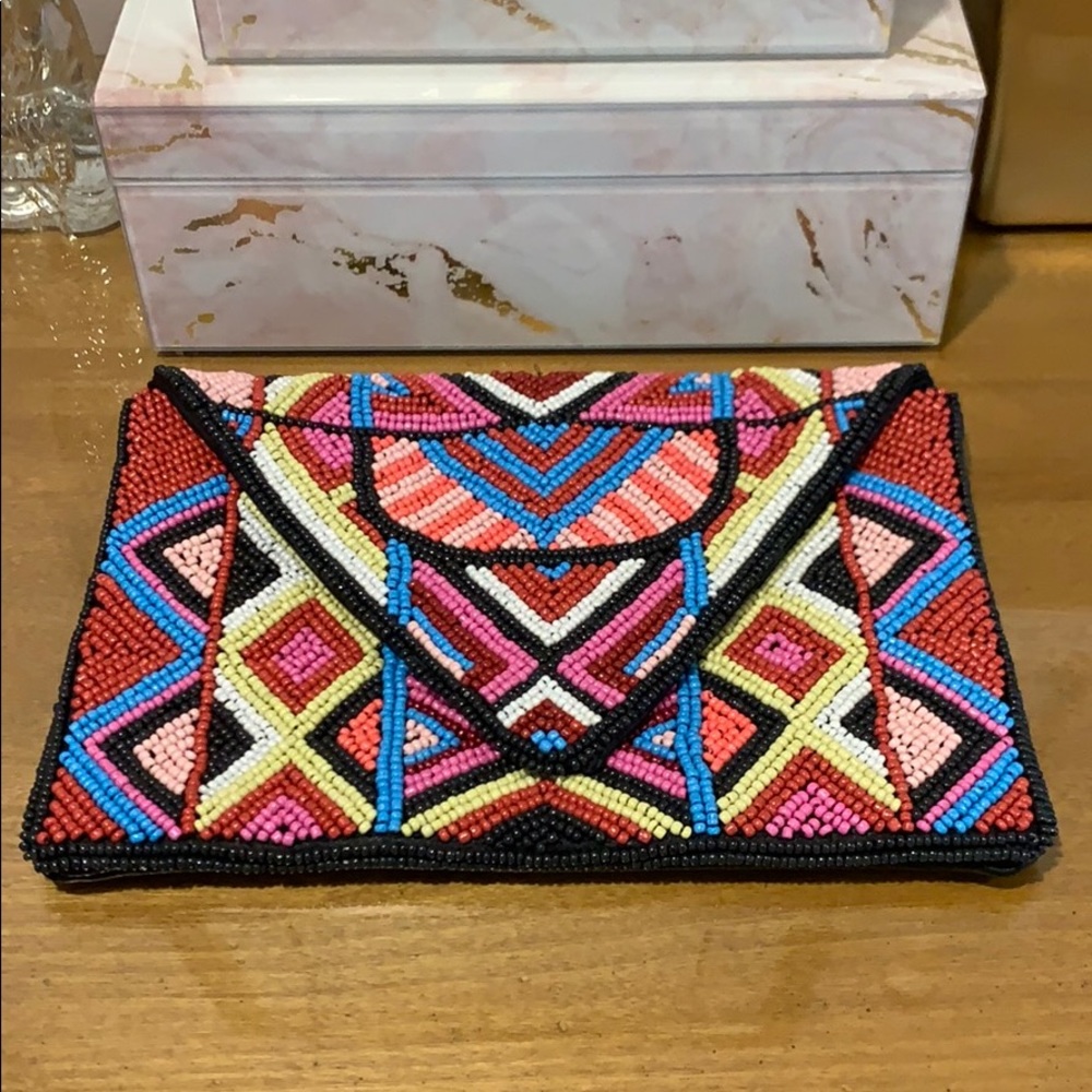 BCBgeneration hand Beaded clutch. New with tags